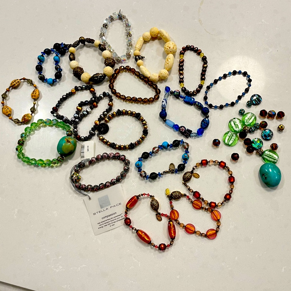 Assorted beaded bracelets and loose beads